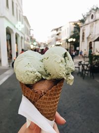 Close-up of hand holding ice cream cone