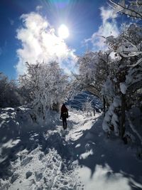 Winter wonderland with pure white snow canopy with redhead woman 