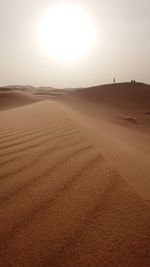 Scenic view of desert against sky during sunset