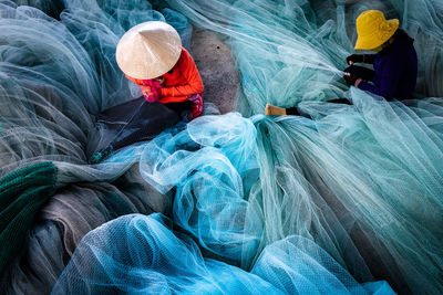 High angle view of people working in water