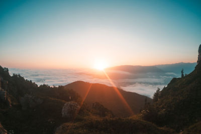 Scenic view of mountains against sky during sunset