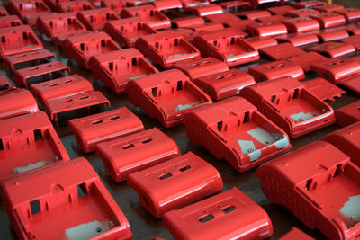 Full frame shot of red plastic electrical equipment at factory