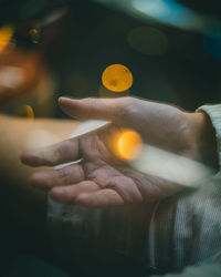 Close-up of person holding cigarette