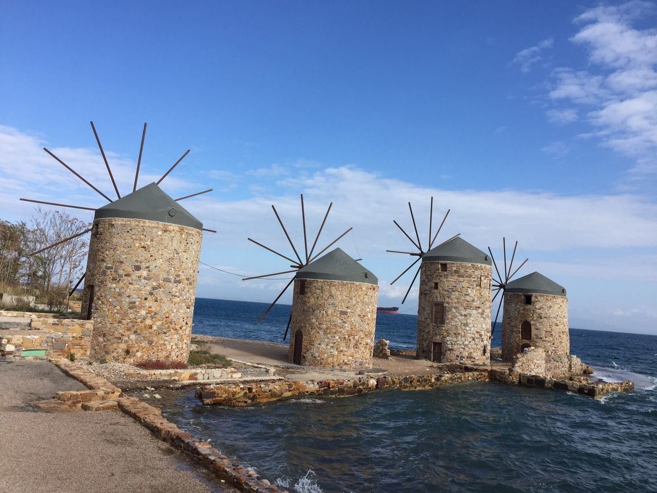 built structure, architecture, sky, sea, water, building exterior, old, abandoned, horizon over water, nature, blue, day, damaged, tree, tranquility, no people, obsolete, bare tree, outdoors, weathered