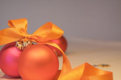 Close-up of orange baubles on table