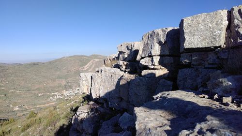 Scenic view of mountain against clear blue sky