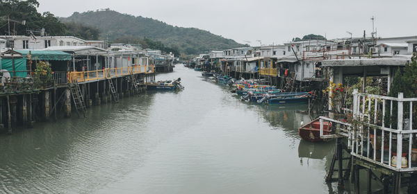 Panoramic view of people on river against sky