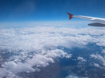 Aerial view of landscape against cloudy sky