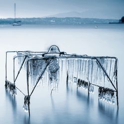 Scenic view of frozen lake against sky