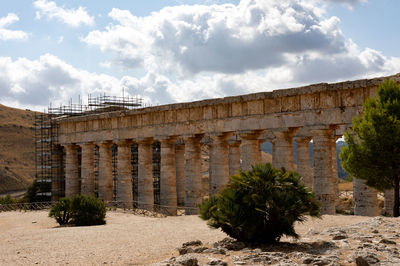 Old ruin building against cloudy sky