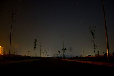 Road against sky at night