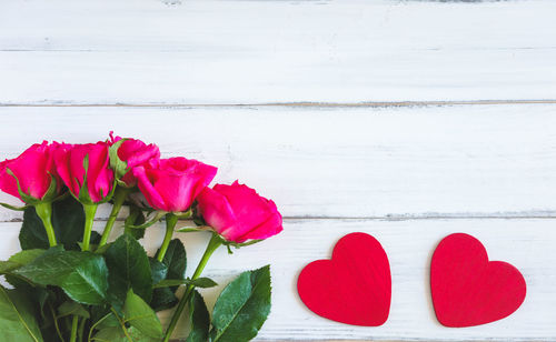 Close-up of red rose on table