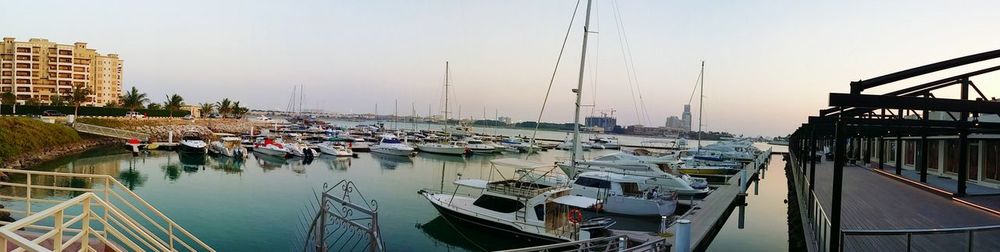 Boats moored at harbor