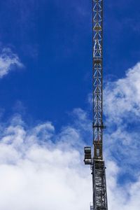 Low angle view of communications tower against sky