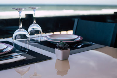 Close-up of wine glasses on table at restaurant