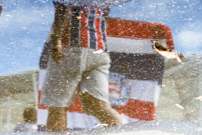 Supporters of the esporte clube bahia football team.  reflection of the water.