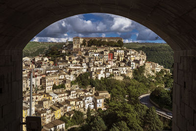 High angle view of buildings in city against sky