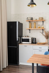 Interior of kitchen in rustic style with vintage kitchen ware and wooden wall