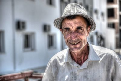 Portrait of senior man wearing hat