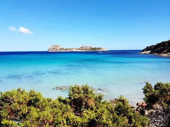 Scenic view of sea against blue sky