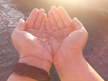 Low section of woman with hands