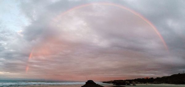 Scenic view of rainbow over sea