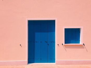 Blue door and window of house