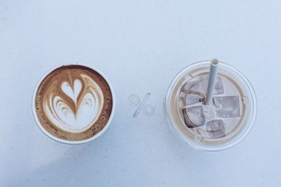 Close-up of coffee cup over white background