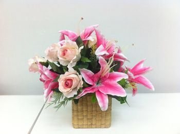 Close-up of pink roses in vase on table