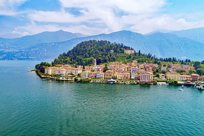 Panoramic shot of townscape by sea against sky