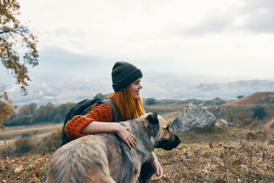 Rear view of man with dog