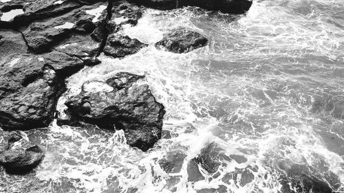 High angle view of rocks in sea