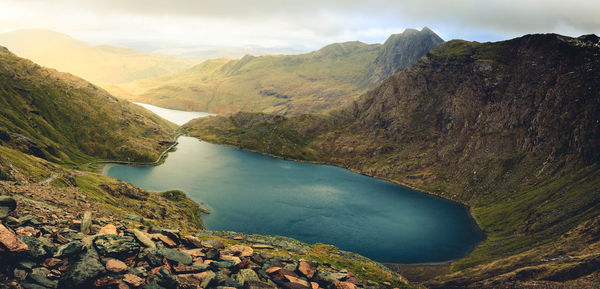 Scenic view of lake and mountains against sky