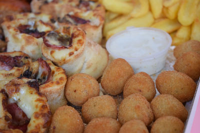 Fast food mix, pizza rolls, cheese meatballs, fries, chicken wings