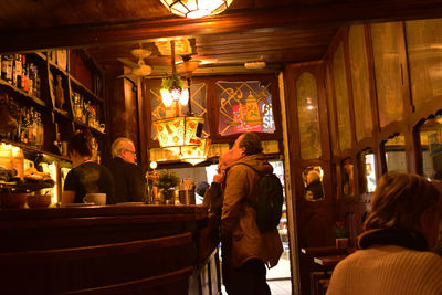 Rear view of people sitting in restaurant