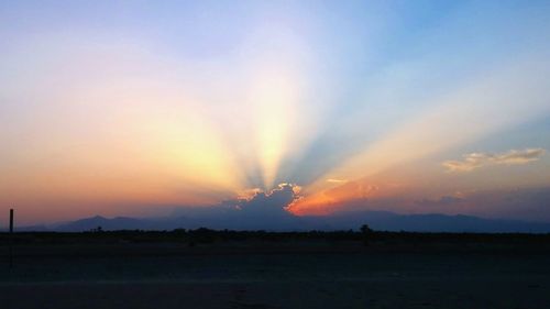 Scenic view of landscape against sky during sunset