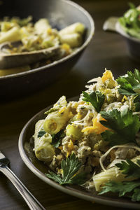 Close-up of chicken and rigatoni served in plate on table