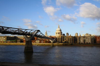 View of bridge over river against cloudy sky