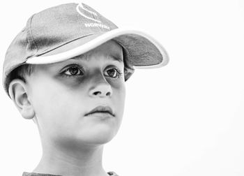 Portrait of happy boy against white background