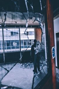 Man standing in abandoned building