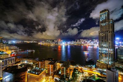 Aerial view of illuminated buildings in city at night