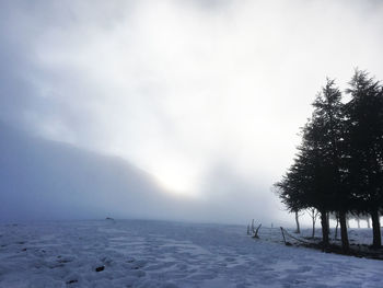 Scenic view of snowcapped landscape against sky