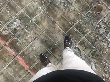 Low section of man standing outdoors