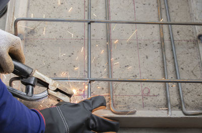 Low section of man on tiled floor