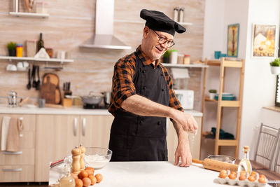 Man preparing food in kitchen