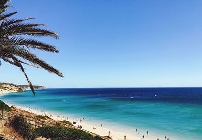 Scenic view of sea against clear blue sky