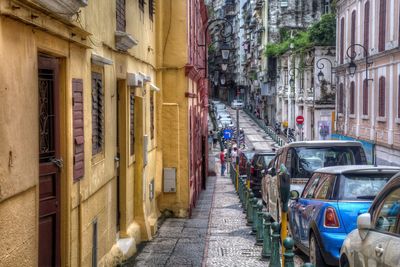 Cars parked on street amidst buildings