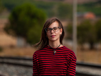 Portrait of teenage girl standing outdoors