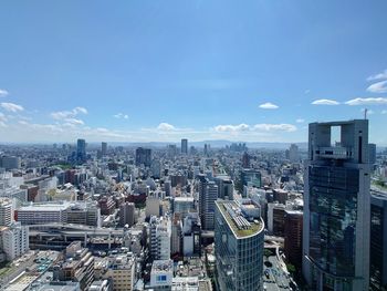 High angle view of buildings in city against sky