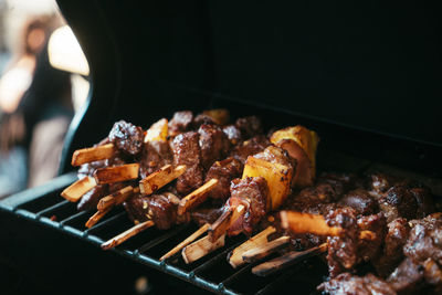 Close-up of meat on barbecue grill